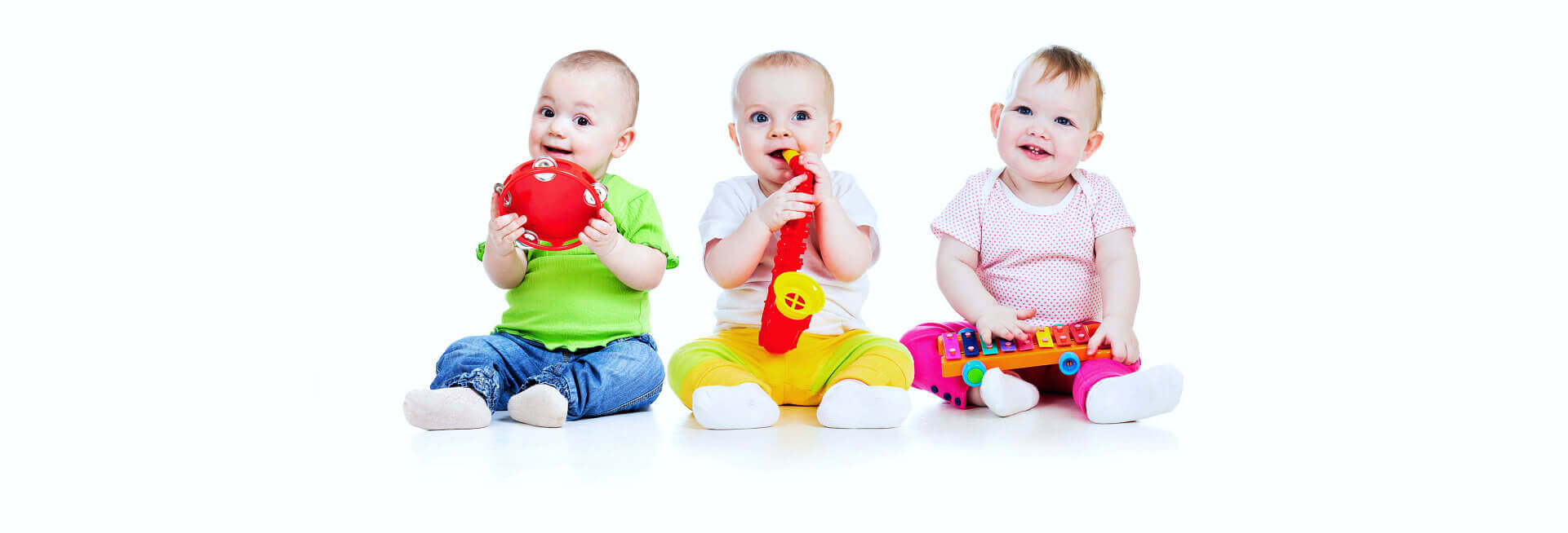 three babies smiling